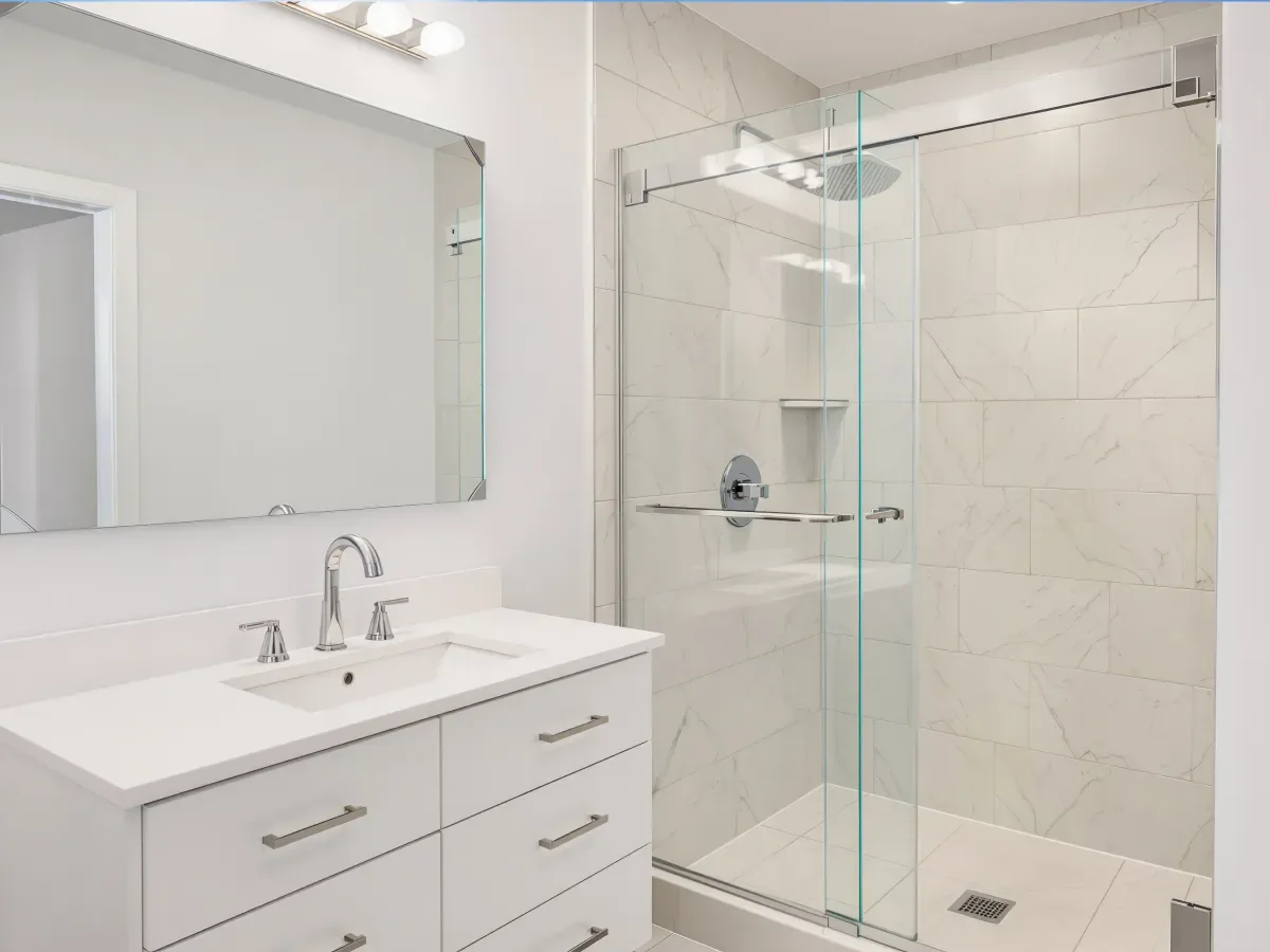 Marble look tile sliding glass shower in Palm Bay