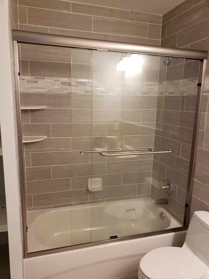 Sliding tub enclosure towel bars corner shelves in Cocoa